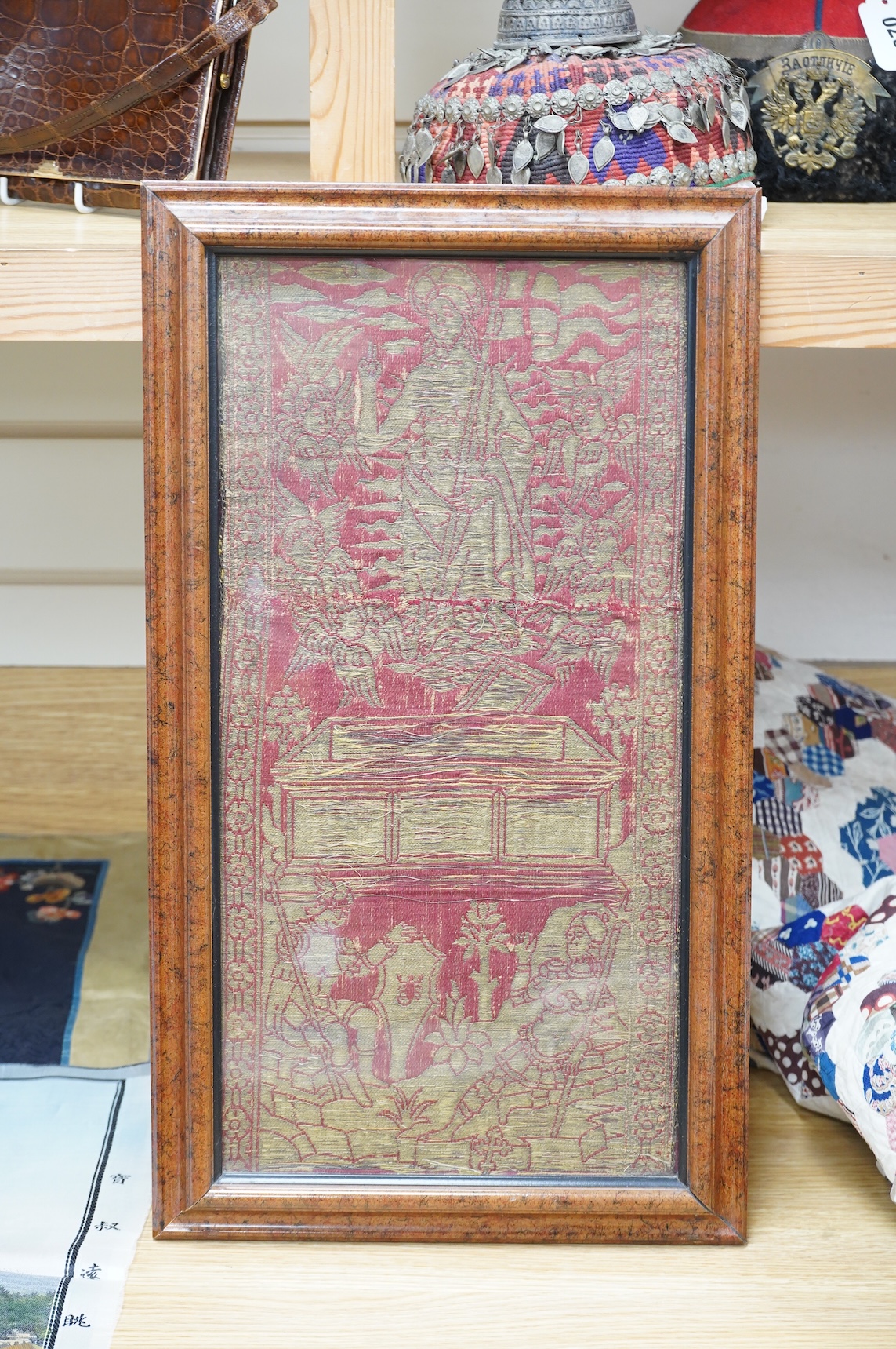 A late 15th century Florentine red silk and gold brocade Lampas, a single repeat designed within a classical setting, being part of an Orphrey depicting the Resurrection, 43.5cm long x 22cm wide, with later frame. Please